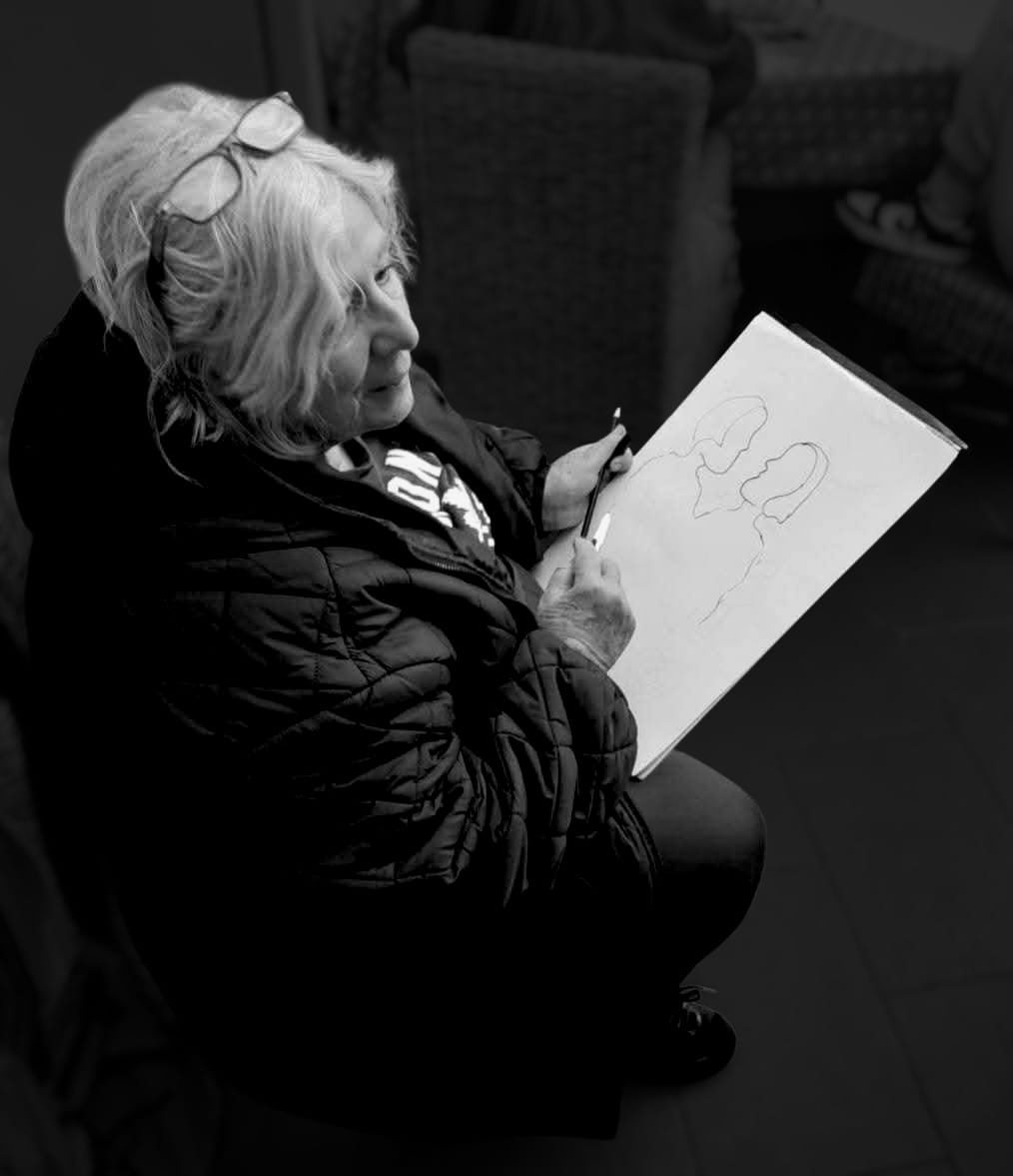Susan Kistner sketching a design by hand — textile artist and designer behind Bright Hopes Art